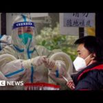 China’s health service under pressure as Covid infections surge – BBC News
